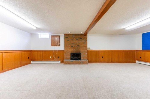 1008 Shawnee Drive Sw, Calgary, AB - Indoor With Fireplace