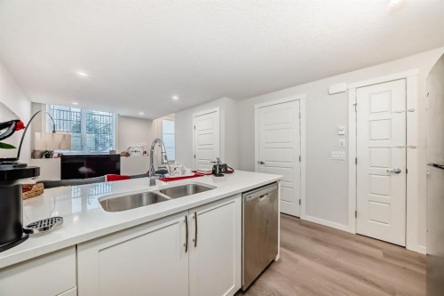 405-474 Seton Circle, Calgary, AB - Indoor Photo Showing Kitchen With Double Sink