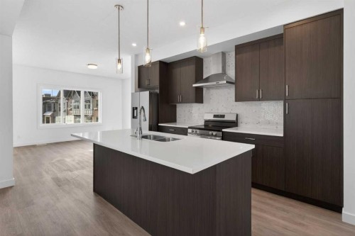 140-2231 81St Street Sw, Calgary, AB - Indoor Photo Showing Kitchen With Double Sink With Upgraded Kitchen