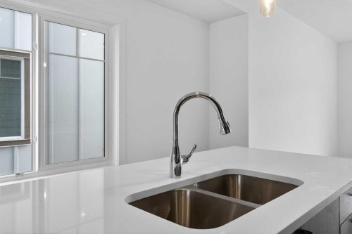 140-2231 81St Street Sw, Calgary, AB - Indoor Photo Showing Kitchen With Double Sink