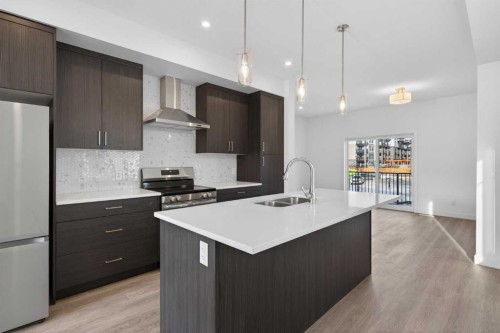 140-2231 81St Street Sw, Calgary, AB - Indoor Photo Showing Kitchen With Stainless Steel Kitchen With Double Sink With Upgraded Kitchen