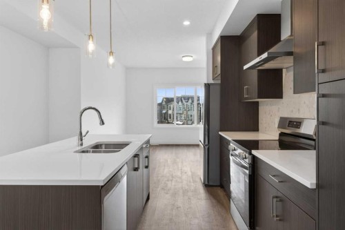 140-2231 81St Street Sw, Calgary, AB - Indoor Photo Showing Kitchen With Double Sink With Upgraded Kitchen
