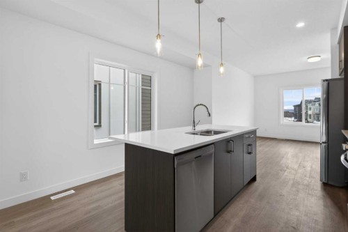 140-2231 81St Street Sw, Calgary, AB - Indoor Photo Showing Kitchen With Double Sink With Upgraded Kitchen