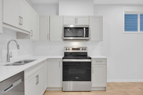153 Edith Way Nw, Calgary, AB - Indoor Photo Showing Kitchen With Double Sink With Upgraded Kitchen