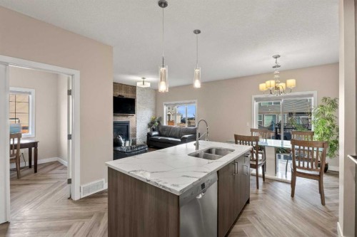 320 Nolancrest Circle Nw, Calgary, AB - Indoor Photo Showing Kitchen With Fireplace With Double Sink With Upgraded Kitchen
