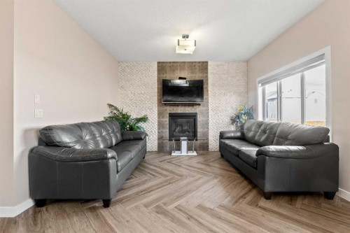 320 Nolancrest Circle Nw, Calgary, AB - Indoor Photo Showing Living Room With Fireplace