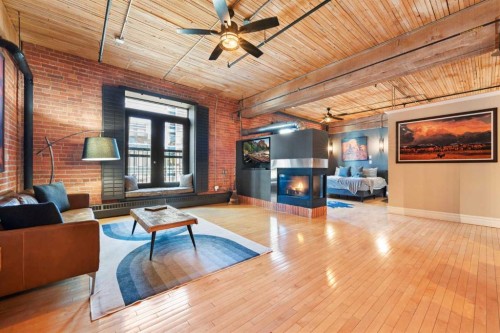 305-535 10 Avenue Sw, Calgary, AB - Indoor Photo Showing Living Room With Fireplace
