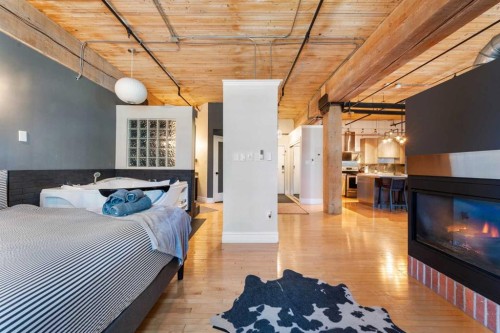 305-535 10 Avenue Sw, Calgary, AB - Indoor Photo Showing Bedroom With Fireplace