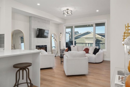 104 Crestridge Common Sw, Calgary, AB - Indoor Photo Showing Living Room With Fireplace