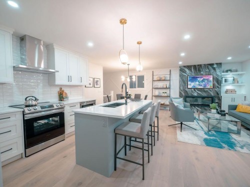 1349 Lake Sylvan Drive Se, Calgary, AB - Indoor Photo Showing Kitchen With Stainless Steel Kitchen With Double Sink With Upgraded Kitchen