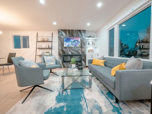 1349 Lake Sylvan Drive Se, Calgary, AB - Indoor Photo Showing Living Room With Fireplace