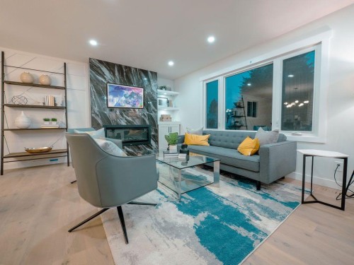 1349 Lake Sylvan Drive Se, Calgary, AB - Indoor Photo Showing Living Room With Fireplace