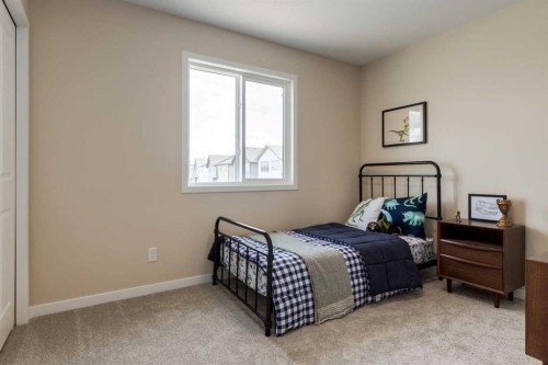 36 Ellen Lane, Crossfield, AB - Indoor Photo Showing Bedroom