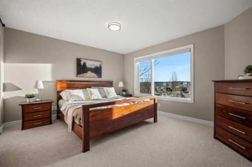 242 Tuscany Ridge Park Nw, Calgary, AB - Indoor Photo Showing Bedroom