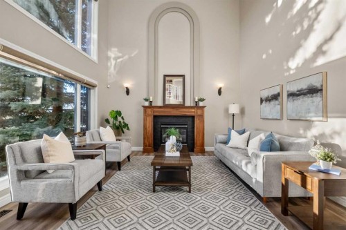 242 Tuscany Ridge Park Nw, Calgary, AB - Indoor Photo Showing Living Room With Fireplace