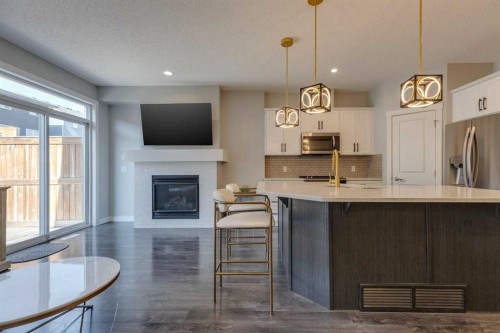 55 Sage Bluff Heights Nw, Calgary, AB - Indoor Photo Showing Kitchen With Fireplace