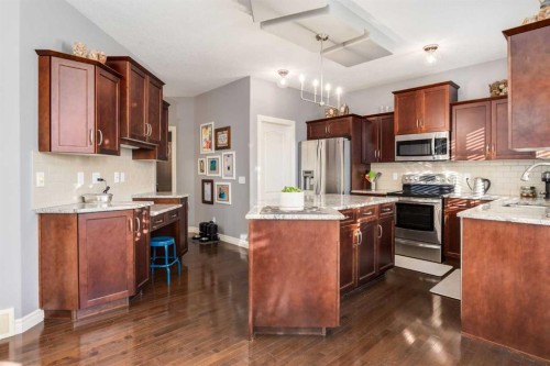 27 Tuscany Estates Drive Nw, Calgary, AB - Indoor Photo Showing Kitchen With Stainless Steel Kitchen With Double Sink