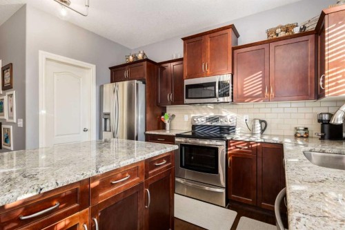 27 Tuscany Estates Drive Nw, Calgary, AB - Indoor Photo Showing Kitchen With Stainless Steel Kitchen