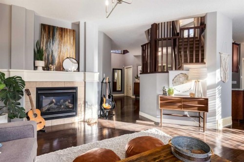 27 Tuscany Estates Drive Nw, Calgary, AB - Indoor Photo Showing Living Room With Fireplace