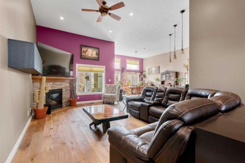 79 Harrison Green, Olds, AB - Indoor Photo Showing Living Room With Fireplace