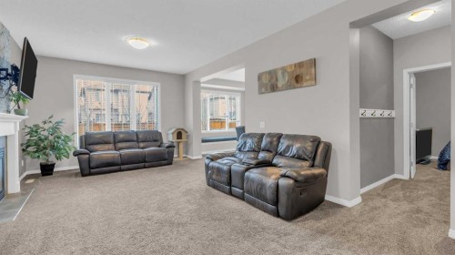 1120 Windhaven Close Sw, Airdrie, AB - Indoor Photo Showing Living Room With Fireplace