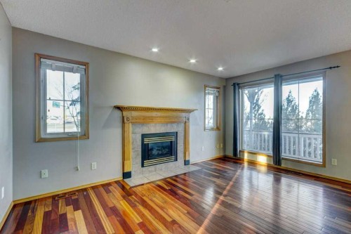 5 Inverness Court Se, Calgary, AB - Indoor Photo Showing Living Room With Fireplace