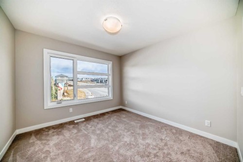 23 Lucas Way Nw, Calgary, AB - Indoor Photo Showing Other Room