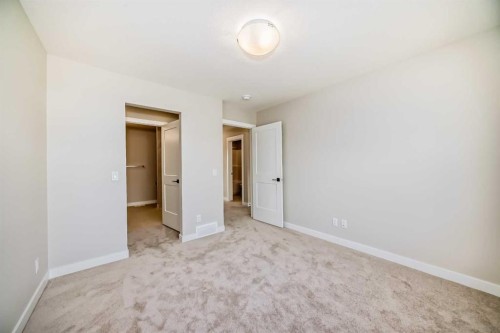 23 Lucas Way Nw, Calgary, AB - Indoor Photo Showing Other Room