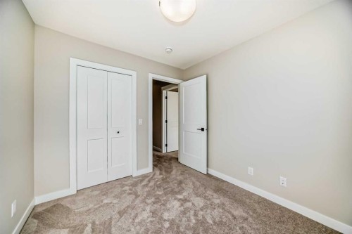 23 Lucas Way Nw, Calgary, AB - Indoor Photo Showing Other Room