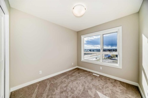 23 Lucas Way Nw, Calgary, AB - Indoor Photo Showing Other Room