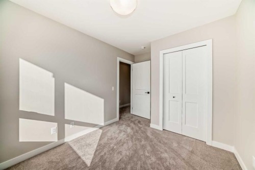23 Lucas Way Nw, Calgary, AB - Indoor Photo Showing Other Room