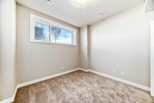 23 Lucas Way Nw, Calgary, AB - Indoor Photo Showing Other Room
