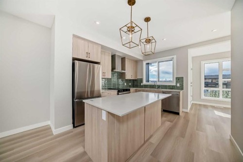 23 Lucas Way Nw, Calgary, AB - Indoor Photo Showing Kitchen With Stainless Steel Kitchen With Upgraded Kitchen