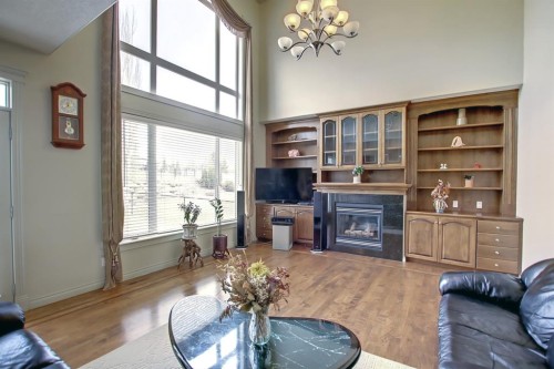 67 Panorama Hills Point Nw, Calgary, AB - Indoor Photo Showing Living Room With Fireplace