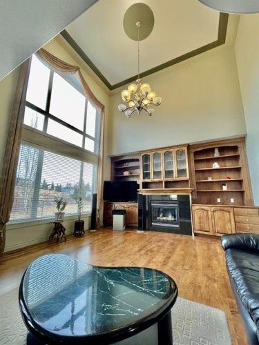 67 Panorama Hills Point Nw, Calgary, AB - Indoor Photo Showing Living Room With Fireplace
