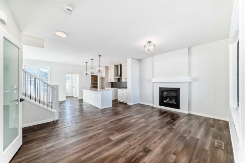 44 Ellen Lane, Crossfield, AB - Indoor Photo Showing Living Room With Fireplace