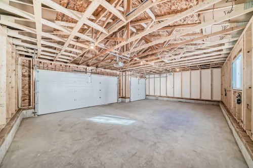 44 Ellen Lane, Crossfield, AB - Indoor Photo Showing Garage