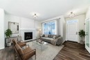 44 Ellen Lane, Crossfield, AB  - Indoor Photo Showing Living Room With Fireplace 