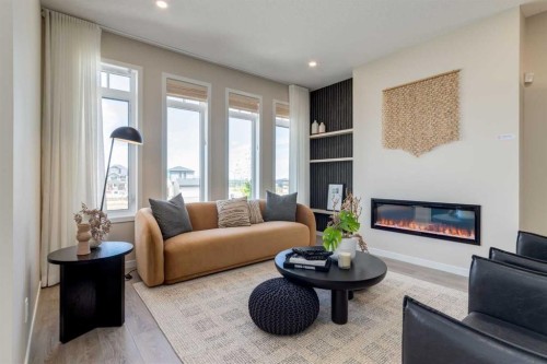 75 Bluerock Terrace Sw, Calgary, AB - Indoor Photo Showing Living Room With Fireplace
