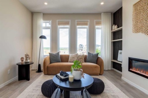 75 Bluerock Terrace Sw, Calgary, AB - Indoor Photo Showing Living Room With Fireplace