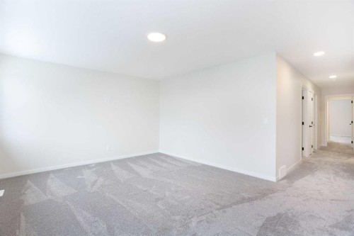 53 Creekside Passage Sw, Calgary, AB - Indoor Photo Showing Other Room