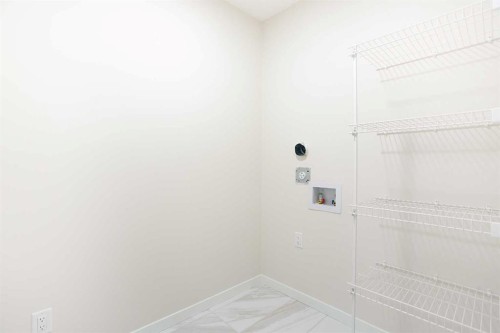 53 Creekside Passage Sw, Calgary, AB - Indoor With Storage