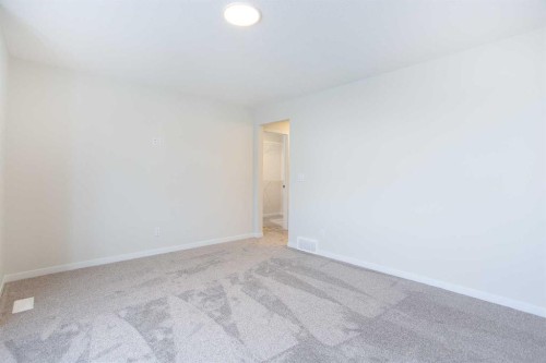 53 Creekside Passage Sw, Calgary, AB - Indoor Photo Showing Other Room
