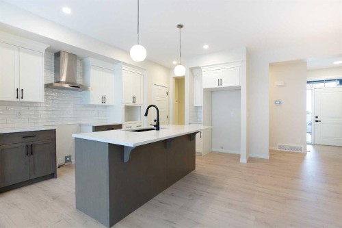 53 Creekside Passage Sw, Calgary, AB - Indoor Photo Showing Kitchen With Upgraded Kitchen