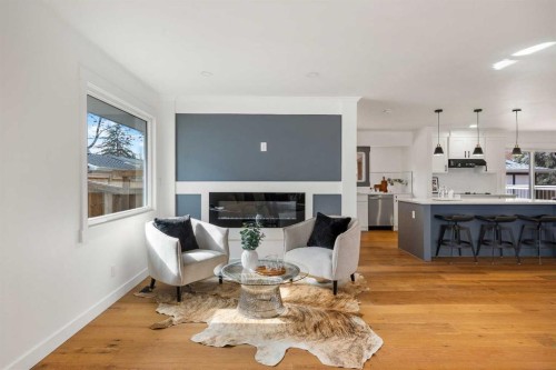 1040 Lake Ontario Drive Se, Calgary, AB - Indoor Photo Showing Other Room With Fireplace