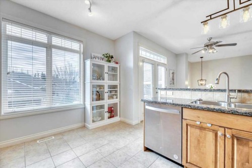 64 Discovery Woods Villas Sw, Calgary, AB - Indoor Photo Showing Kitchen With Double Sink