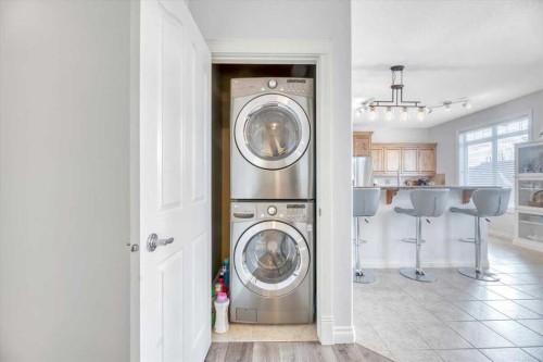 64 Discovery Woods Villas Sw, Calgary, AB - Indoor Photo Showing Laundry Room