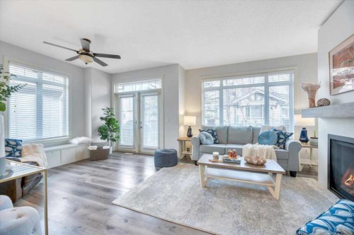 64 Discovery Woods Villas Sw, Calgary, AB - Indoor Photo Showing Living Room With Fireplace