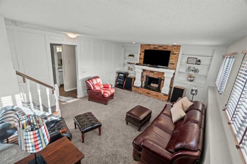 15 Beacham Rise Nw, Calgary, AB - Indoor Photo Showing Living Room With Fireplace