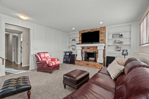 15 Beacham Rise Nw, Calgary, AB - Indoor Photo Showing Living Room With Fireplace